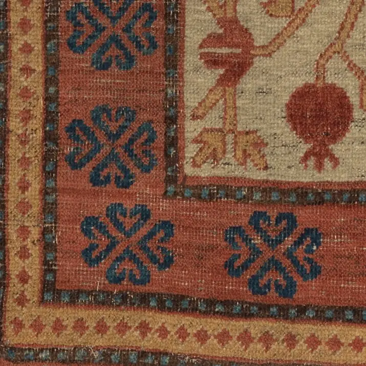 Granaatappeltapijt: detail van de rand